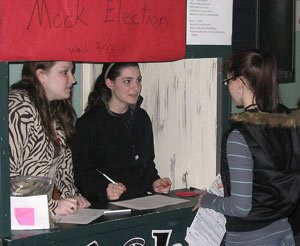 Klahowya Secondary School senior Ashley Harkness (left) and fellow senior Jess Wilson tally votes during Klahowya Secondary Schools mock primary Feb. 13.