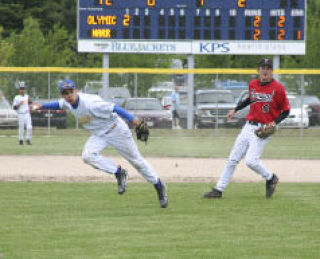 Bremerton shortstop Eli Olson considers firing a throw after barehanding a grounder in the senior all-star game.