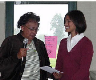 Hazel Colvin presents 2005 Bremerton High School graduate and current Central Washington University student Maria Aragon with the first Al Colvin Continuing Education Student Scholarship at the sixth annual Semancik Bremerton Alumni Golf Tournament last weekend.