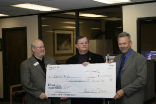 (Left to right) United Way Board Member Barry Loonam and Executive Director David Foote accept a $34