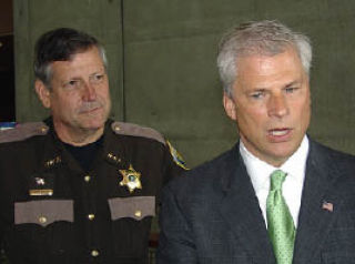 Kitsap County Sheriff Steve Boyer (left) listens to former U.S. Attorney John McKay at Friday’s Law Day ceremony.