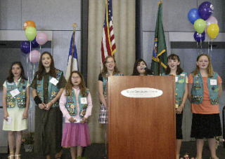 Girl Scouts from Troop 34 sang “Together we change the world” at Wednesday’s Peninsula Leadership Luncheon in Bremerton.