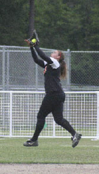 Central Kitsap outfielder Julie Fergus snags a fly ball Thursday.