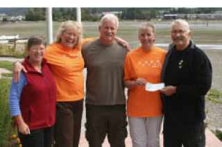 (From left) Central Kitsap Food Bank volunteer and vice president Cindy Saunders