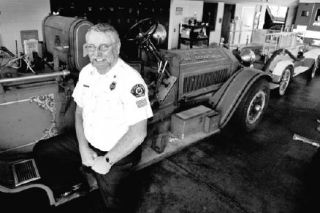 Poulsbo Fire Chief Jim Shields with the department’s 1918 American LeFrance