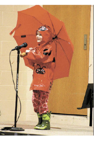 Kindergartner Dylan Brownd pleas to the sun to finally shine down on her.