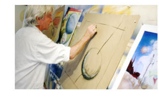 Above: Ron Harper at work in his Port Orchard studio drawing faster-than-light particles called “tachyons.” Left: The face piece of “Paint Free or Die” — “He FREES THE TACHYON HORDES OF BONDS AT LAKE.”