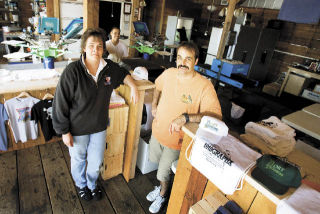 Denise McMahon and Eric Orn brought their businesses from Silverdale to Port Gamble last month. They moved 1010 Graphx and Threads into the old Fire Hall.