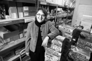 Fishline Food Bank Director Karen Timken shows the food bank’s storage in this file photo. Fishline’s thrift shop is hosting a half-price sale on all clothing from 10 a.m. to 3 p.m. today. All proceeds will benefit Fishline.