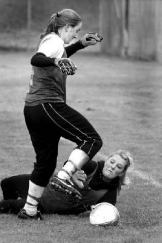 North Kitsap soccer players Christine Parker and Brooklyn Fairchild battle for point during soccer tryouts this week.