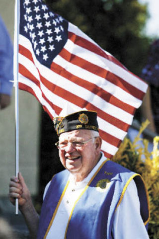 Navy veteran and Americal Legion post 245 member Fred Reitmeyer joined dozens of other community members and city staff for the Freedon Walk from the Poulsbo Parks building through downtown Thursday.