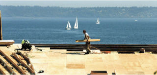 Workers recently assembled roofing on the new longhouse under construction at the Suquamish waterfront. The community is undergoing a transformation