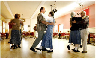 Kim and Mary Barker (center) joined about a dozen other adults for a good-for-the-soul beginning folk dancing class at the Poulsbo Sons of Norway lodge.