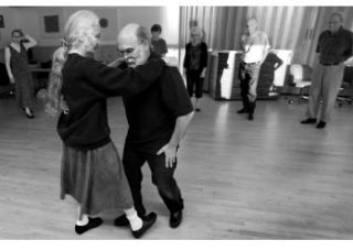 Folk dancing instructors Fred and Linda Aalto cut a wooden floor during folk dancing class. Classes are held Monday nights