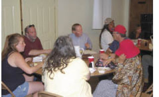 Bremerton mayoral candidate Will Maupin (center) chatted with some of Bremerton’s homeless Aug. 27 when Kitsap County elected officials were invited to have lunch with them at the Salvation Army.