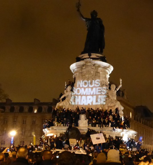 Nous sommes Charlie (We are Charlie) projected on the monument at Place de la République