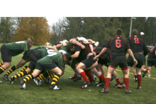 (Top) Fort Lewis and Bangor mix it up in a srum during Saturday’s Commaner’s Cup at Strawberry Fields in Poulsbo.