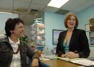 Gallery of Hair Design owner Tami Blacknall (right) reserves her space at next week’s business expo