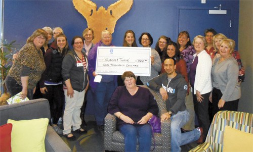 Members of Soroptimists International of Greater North Kitsap present a donation of $1