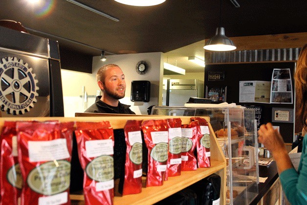 Curtis Zulauf assists customers at Coffee Oasis in Poulsbo.