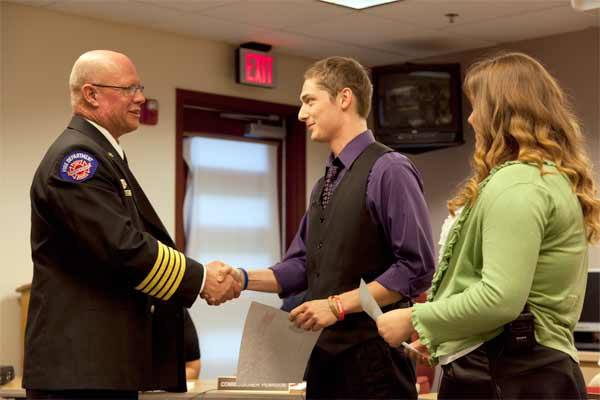 Zachary Myers and Kyleigh Potter were recognized Sept. 9 for helping save Mark Potter's life when the 53-year-old went into cardiac arrest. Myers and Kyleigh were congratulated by North Kitsap Fire & Rescue Fire Chief Dan Smith