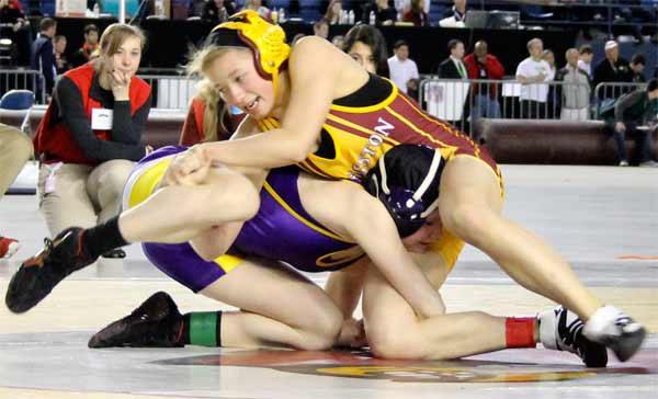 Kingston’s Peyton Reece wrestles Puyallup’s Jordyn Bartelson in the 118-pound 2A state wrestling finals Feb. 22 in the Tacoma Dome.