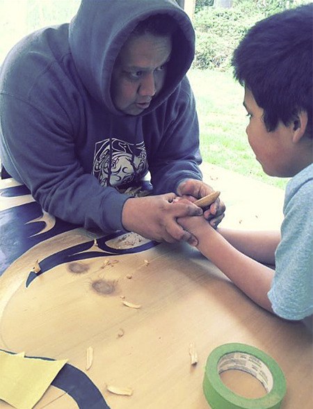 S'Klallam artist Jimmy Price works with his son