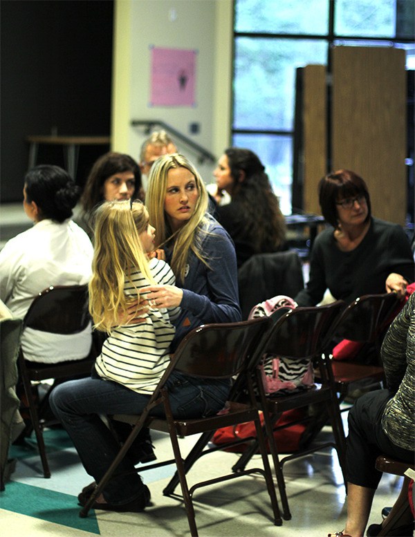 Residents listen to neighbors’ comments April 13 during a meeting about the proposed Arborwood community. The Kingston-area development would consist of 765 homes on 361 acres.