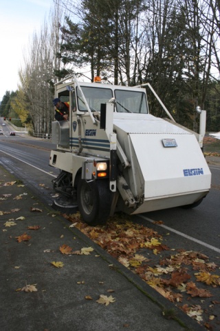 Public Works employee Rob Perkins sweeps up leaves on Lincoln Road in Poulsbo. Clearing gutters is one of the ways Public Works is preparing for colder weather.