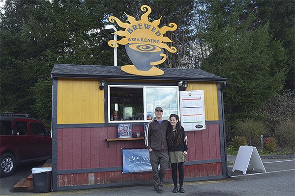 Jason and Marcy Cartwright stand in front of their coffee business Brewed Awakening