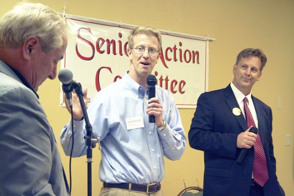 State Sen. Derek Kilmer and challenger Marty McClendon take questions from moderator Tim Mathes during Saturday’s candidate forum at Towne Square Port Orchard.