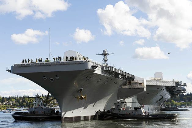 The Nimitz-class aircraft carrier USS John C. Stennis pulls out of dry dock.