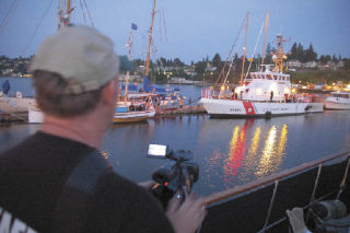 Videographer Ron Finney shooting boats at Port Orchard Marina during Fathoms o’Fun and the Tall Ships visit for the Port Orchard visitors’ video.