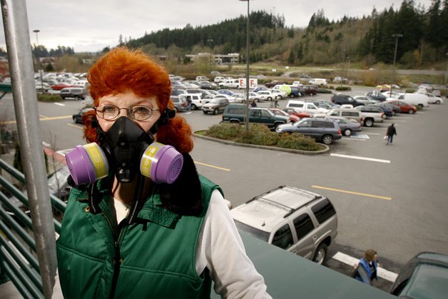 Poulsbo resident Joan Walz is known about town for her shocking red hair and purple gas mask. Walz suffers from an extreme case of Multiple Chemical Sensitivity