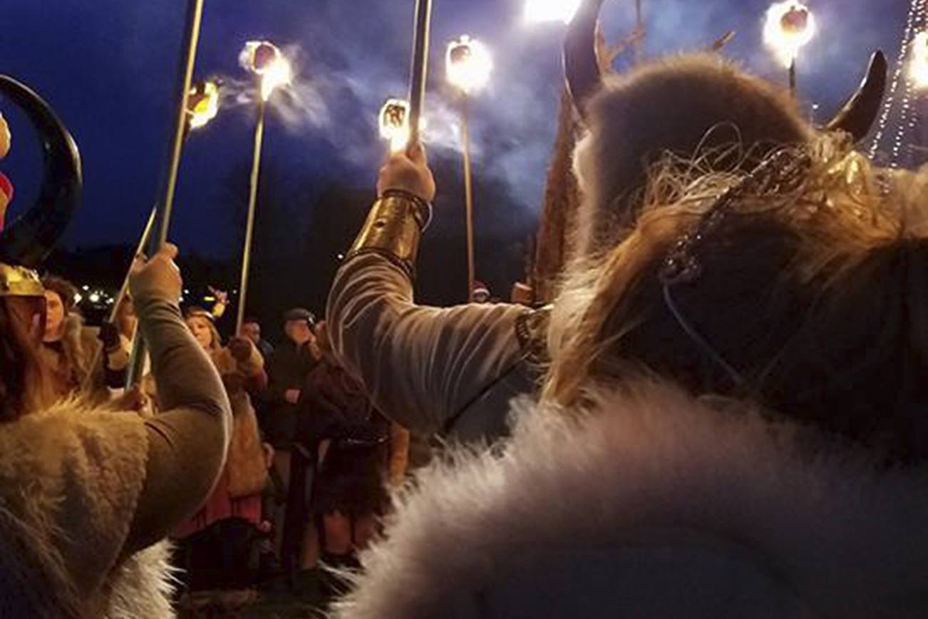 Vikings’ torches light the night sky during the Julefest celebration, Dec. 3 at Muriel Iverson Williams Waterfront Park. (Angie Donovan/Kitsap News Group correspondent)