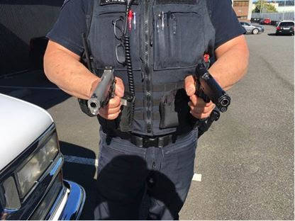 A Bremerton Police officer took this picture. Which handgun is real? Which one is a replica? What if your life depended on making the right choice? (Bremerton Police Department)