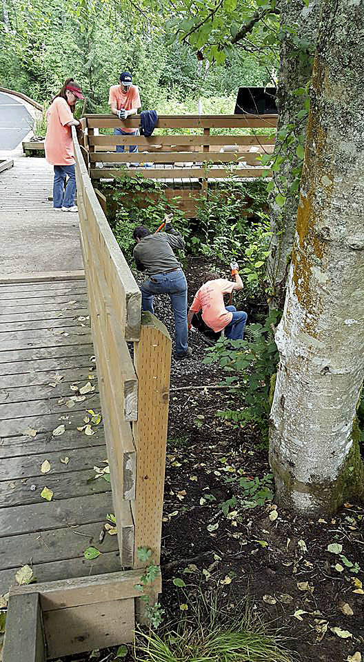 United Way photo                                Volunteers work at Fish Park in Poulsbo at a previous United Way Day of Caring.