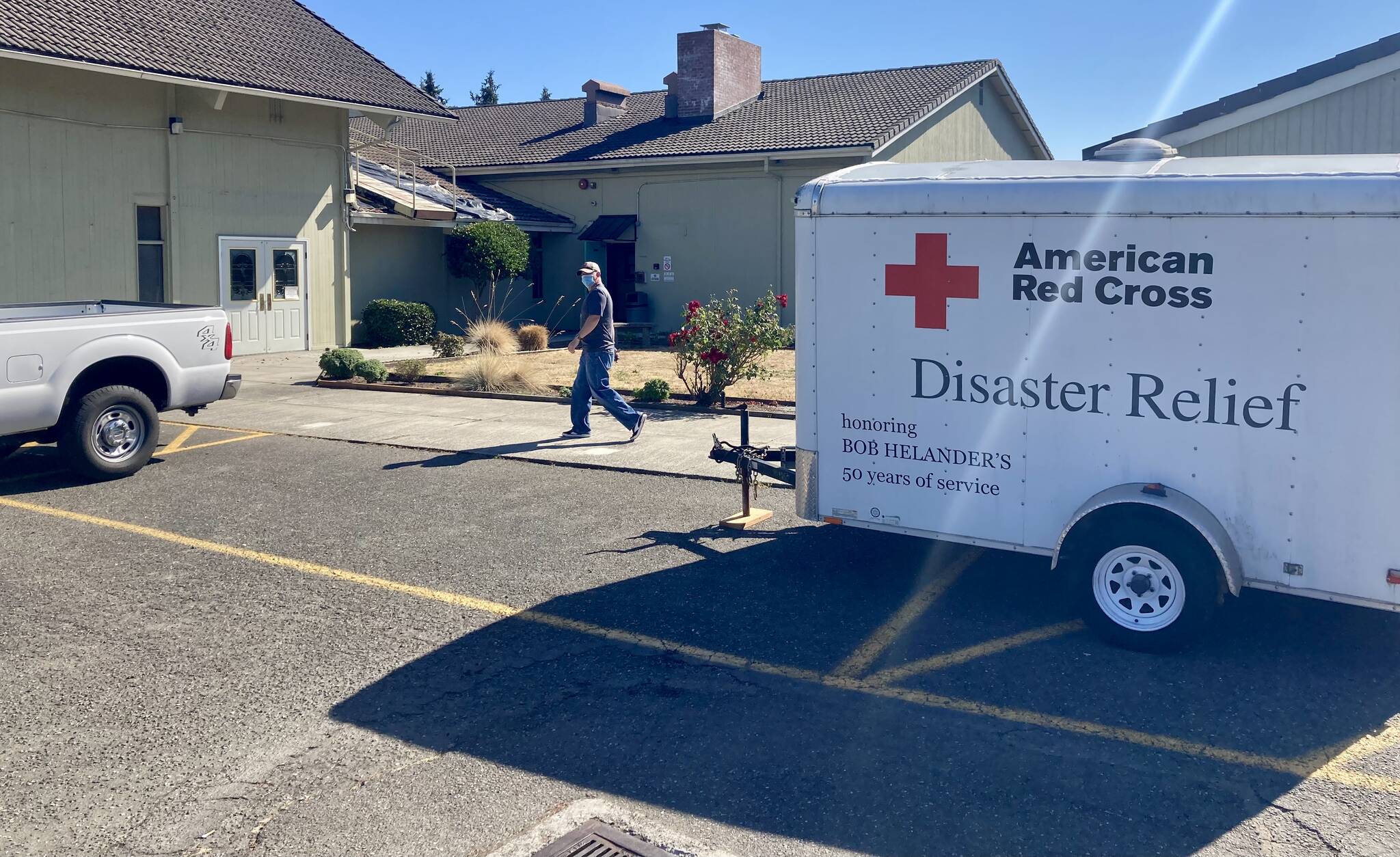 Red Cross vehicles and trailers sit outside the Silverdale United Methodist Church, which was activated as an emergency shelter for the fire victims. Elisha Meyer/Kitsap News Group