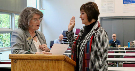 New North Kitsap school board member Barbara Waggoner is sworn in by Poulsbo Mayor Becky Erickson. Courtesy Photos