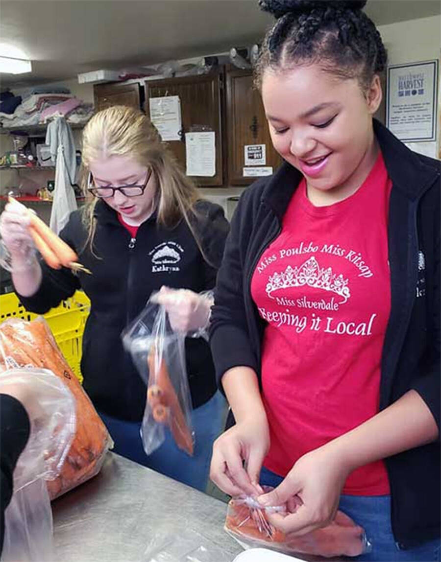 Volunteers at the Central Kitsap Food Bank pack items for holiday meals. Courtesy Photos