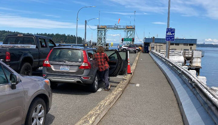 Riders wait for the Southworth ferry. File Photo