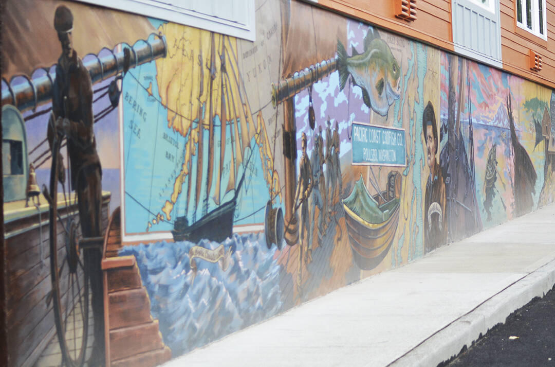 A historic mural signed by artist Steffon Moody brightens up a side of a new housing structure being built just off Front Street in downtown Poulsbo. Steve Powell/Kitsap News Group