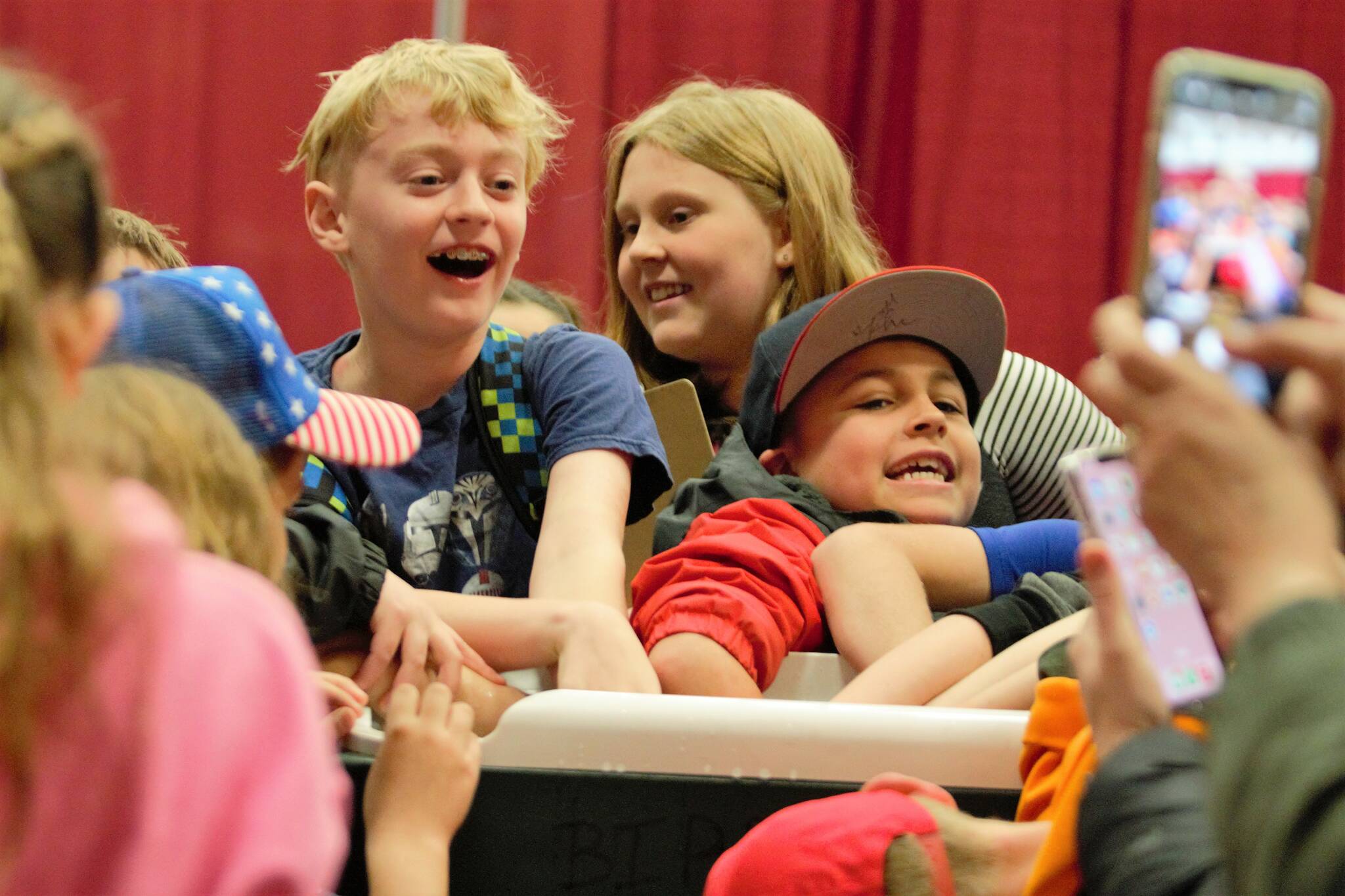 A group of students tries to remain ‘chill’ while dipping their hands in a cooler of ice water. Elisha Meyer/Kitsap News Group Photos