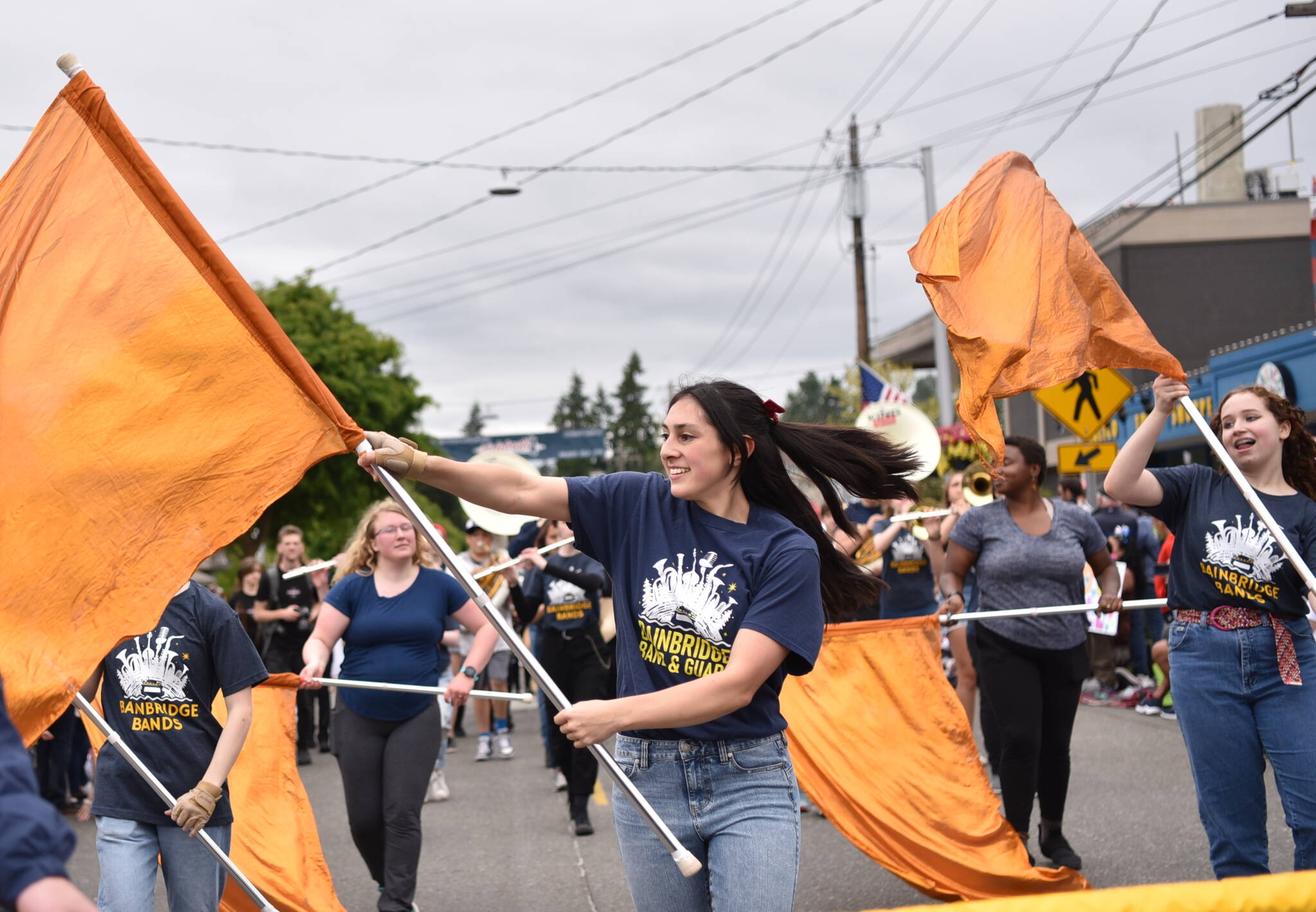 File Photos
Bainbridge High School Color Guard member Margaret Haley performs in the 2022 4th of July parade in Winslow.