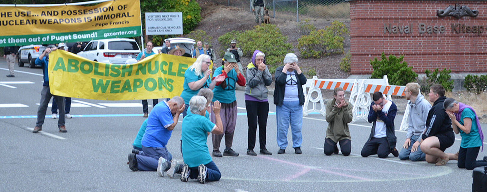 A group attending the three-day Ground Zero conference protests in the street leading to the Bangor base. Ground Zero courtesy photo