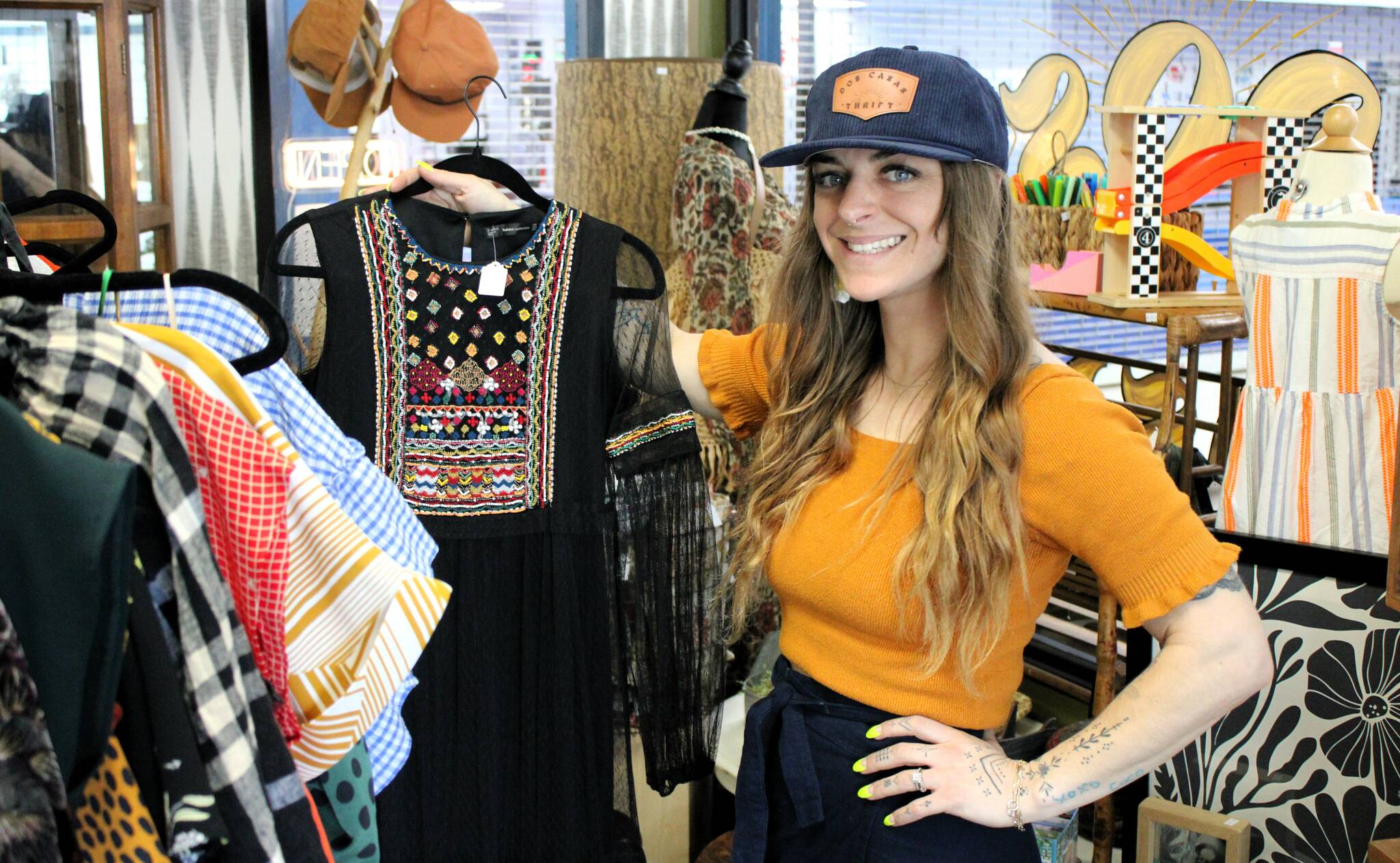 Elisha Meyer/Kitsap News Group
Brittany Hess shows off the collection of spring and summer wear in her new storefront.