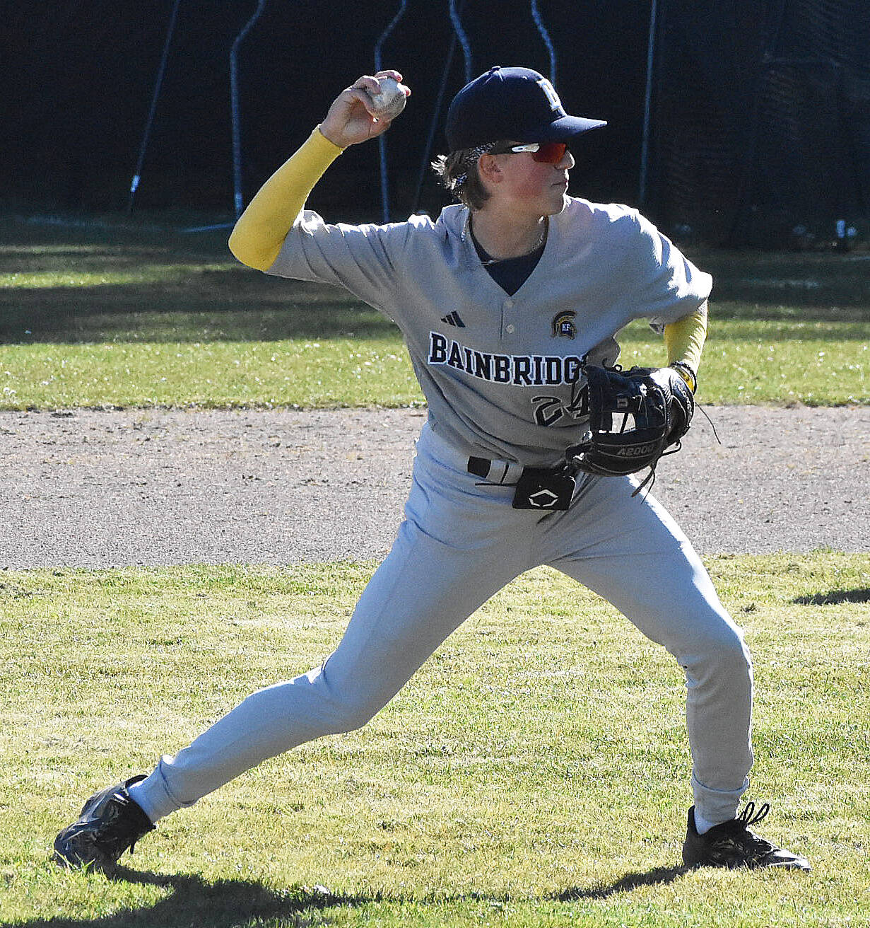 File photo
McCrea Curfman throws the ball to first base.