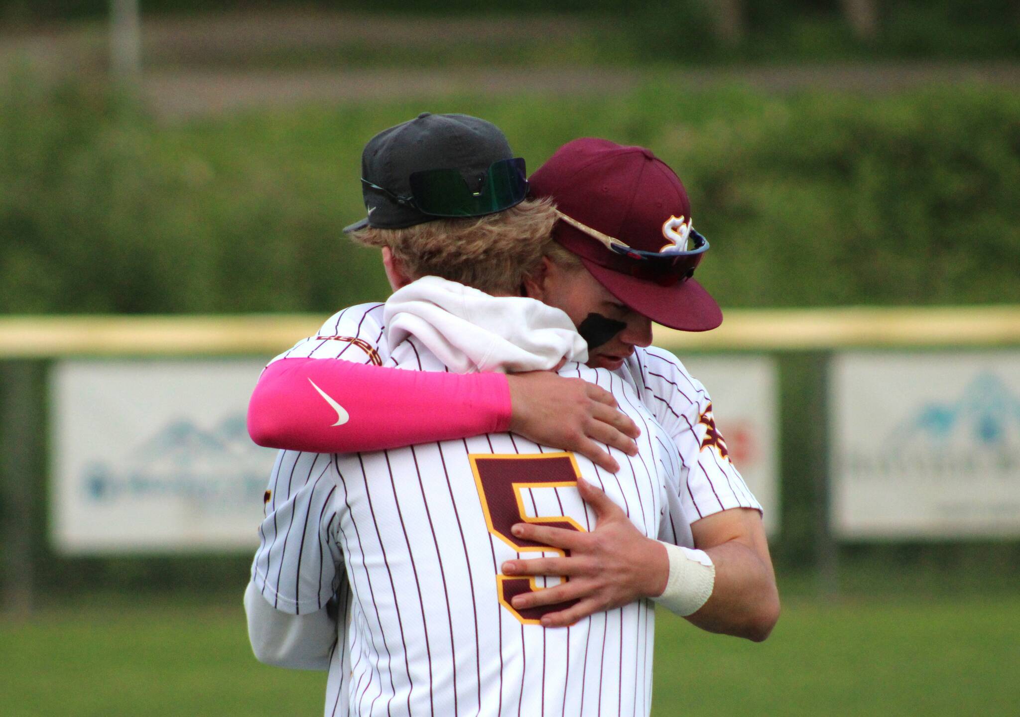 Elisha Meyer/Kitsap News Group photos
Nolan Bayne (5) embraces senior SK teammate Payton Moritz after a home defeat in the district playoffs ends the Wolves’ season.