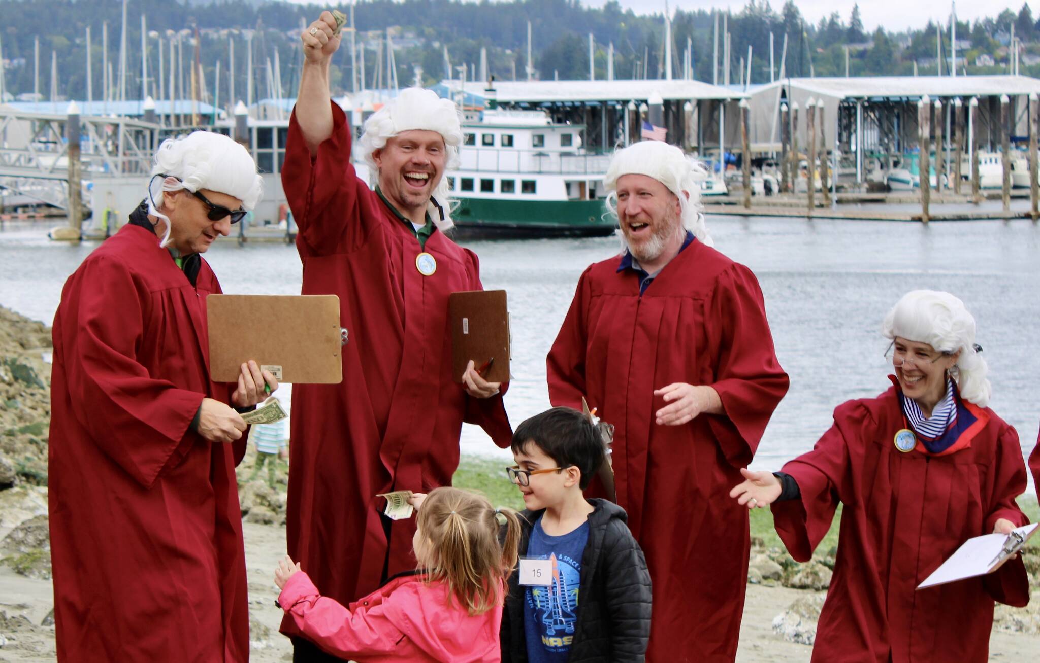 Elisha Meyer/Kitsap News Group photos
These kids boost their chances of winning the 33rd annual Seagull Calling Contest, passing off some green to the judges.