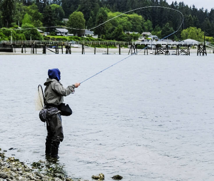 Damon Williams/Kitsap News Group photos
Christian Bell casts his line into Hood Canal.